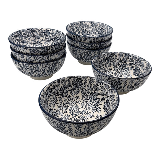 A set of 8 Porcelain bowls with a navy blue floral and botanical pattern on a white background, arranged on a clean white studio background.