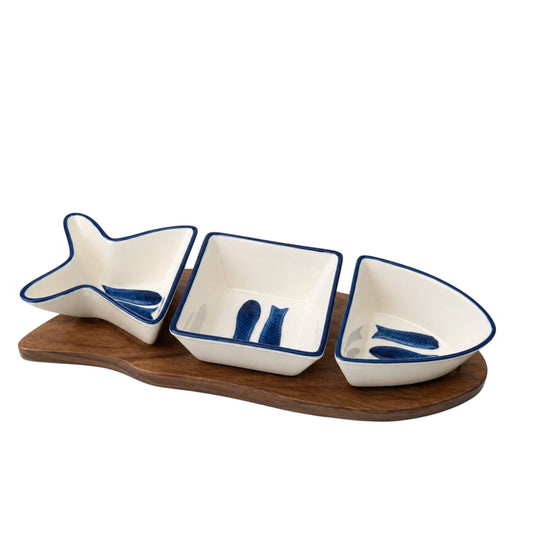 Set of three ceramic bowls with fish designs on a wooden tray