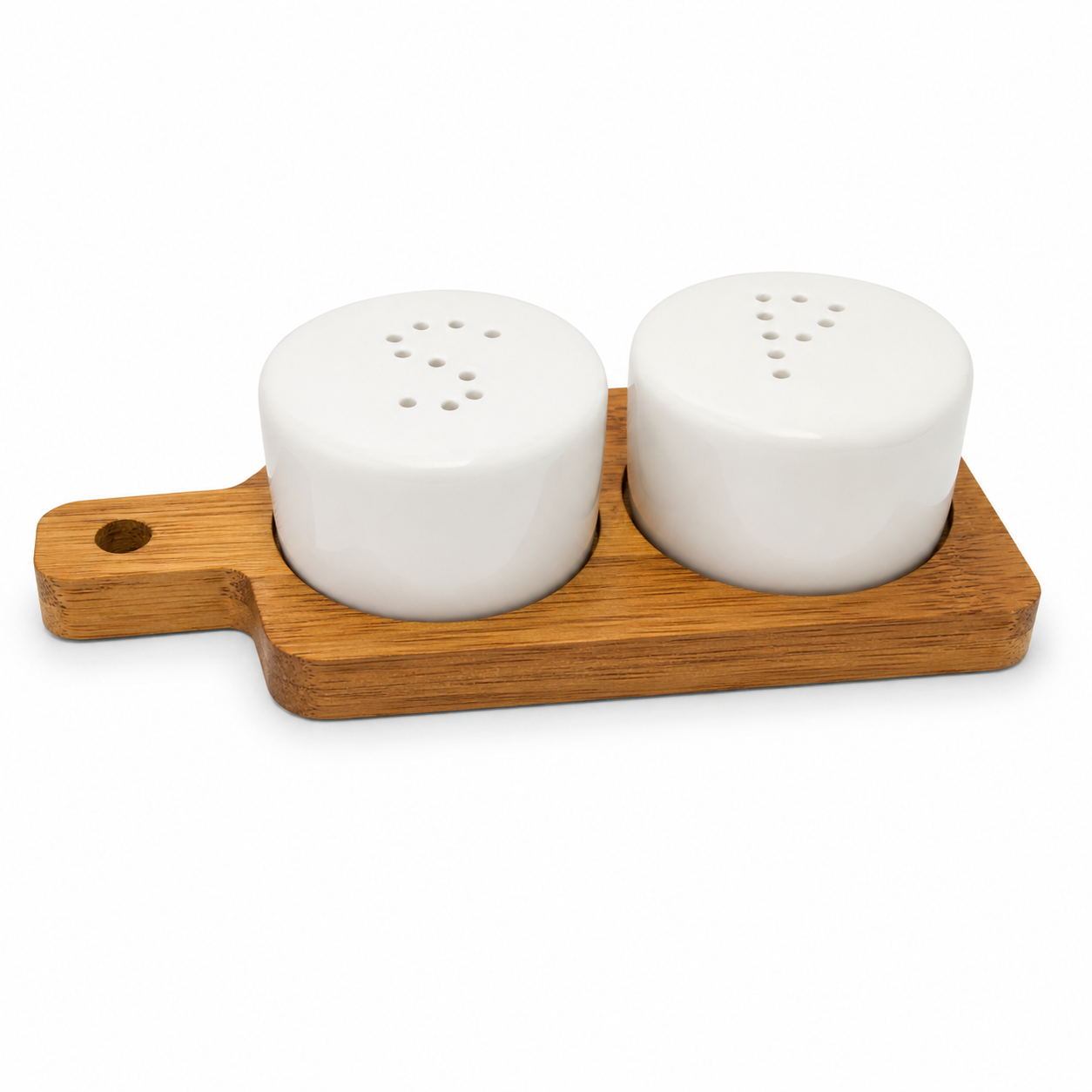 Two white ceramic salt and pepper shakers on a wooden tray with a white background