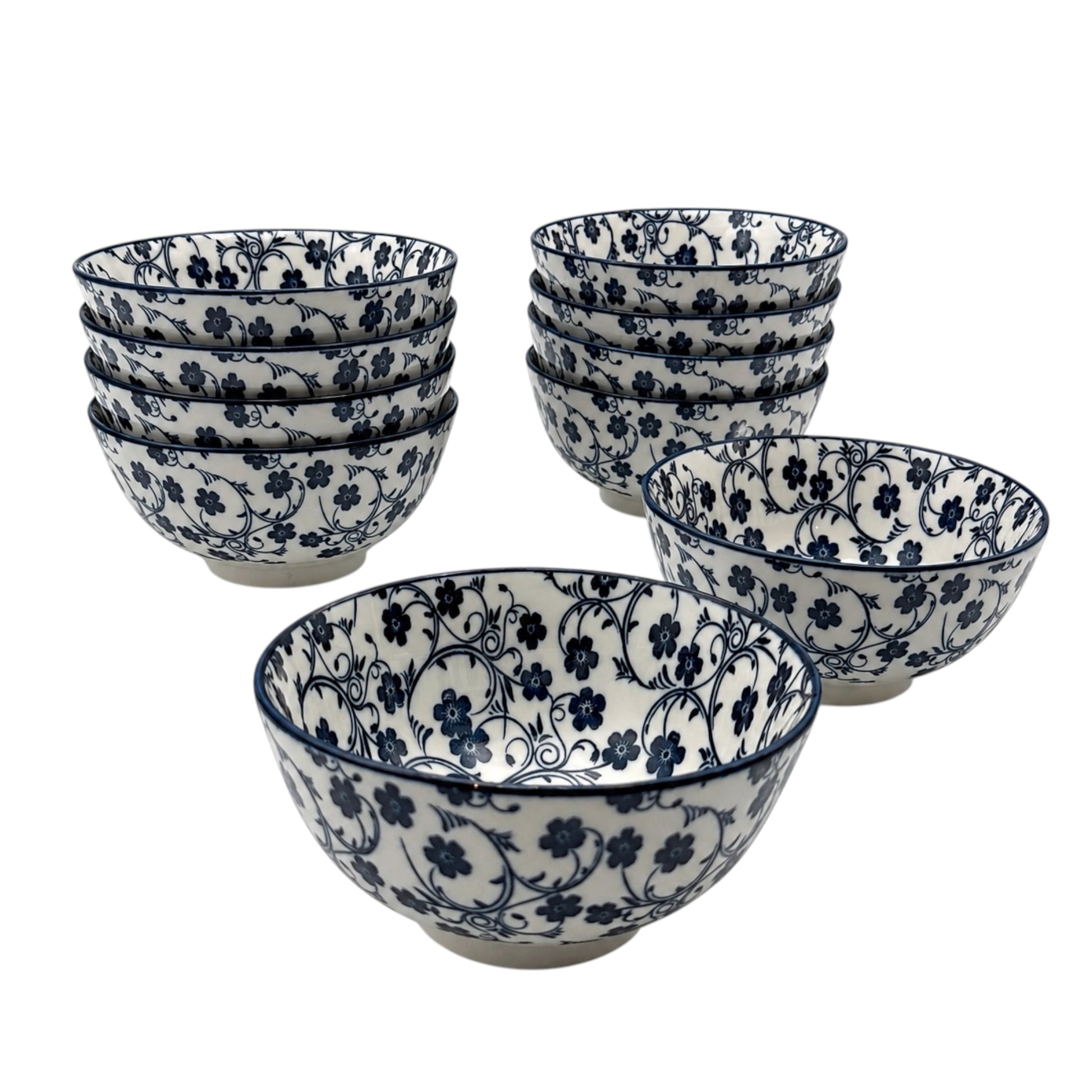 A set of Porcelain bowls with a white base and a dark blue floral vine pattern, shown with one bowl in front and six stacks behind it on a plain white background.