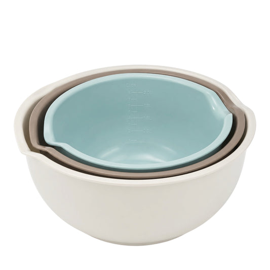 Set of three nested bowls with a light blue interior and beige exterior on a white background