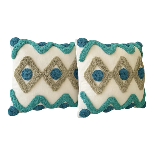 Two decorative Throw pillow covers with geometric pattern and blue accents on a white background