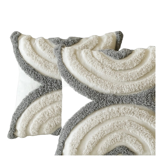 Decorative throw pillow covers with wavy pattern on a gray background